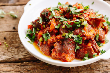 meat with vegetables in tomato sauce 