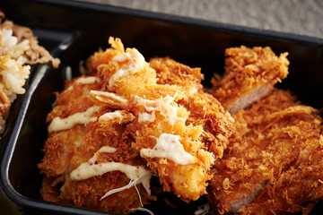 Mixed deep fried dishes in lunch box 