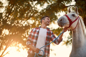 Handsome man and his horse