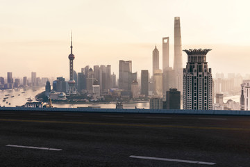 Obraz na płótnie Canvas Asphalt road and urban building of Shanghai, driveway and road.