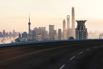 Obraz premium Asphalt road and urban building of Shanghai, driveway and road.