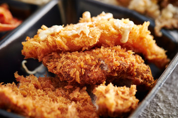 Mixed deep fried dishes in lunch box 