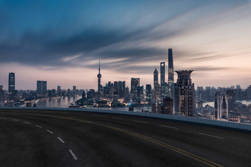 Naklejka na ściany i meble Asphalt road and urban building of Shanghai, driveway and road.