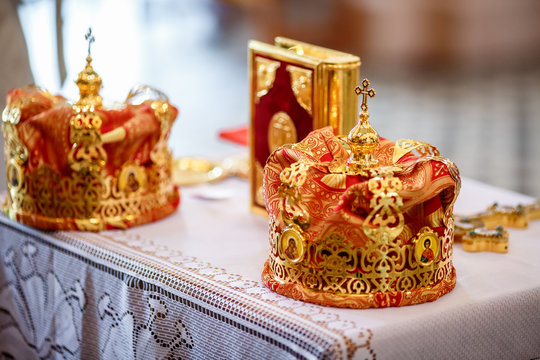golden crown of newlyweds in the church