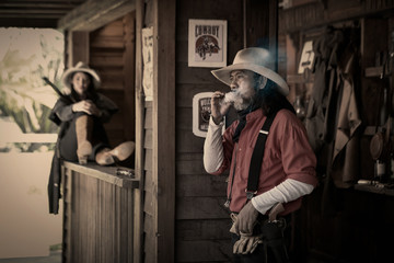 Obraz na płótnie Canvas Action pictures, vintage style of cowboys,