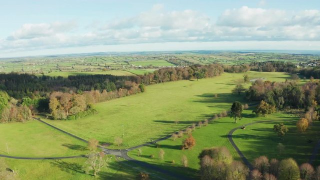 Aerial Flight Over  Castlewellan forest park Lake area countryside Northern Ireland during Autumn time. Hiking And Tourism Concept