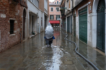 Fototapeta na wymiar VENICE, ITALY - November 12, 2019: flood (acqua alta) in Venice, Italy. Venice high water.