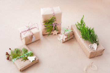 Fototapeta na wymiar Handmade gift boxes wrapped in craft paper