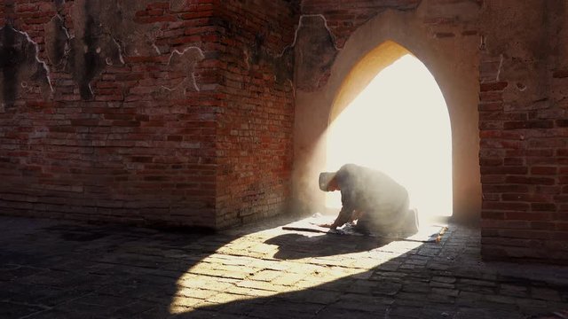 Muslim man praying at an old mosque in Phra Nakhon Si Ayutthaya Province, Thailand, Asian Muslims