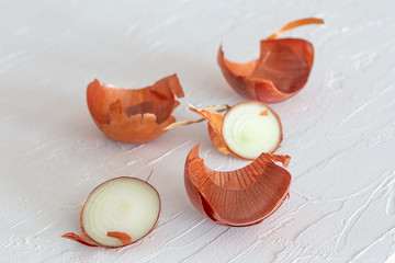 Onion skin and residues on a white surface