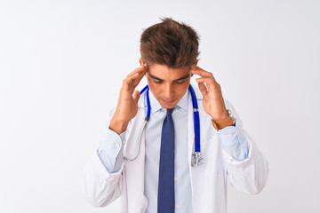 Young handsome doctor man wearing stethoscope over isolated white background with hand on head for pain in head because stress. Suffering migraine.