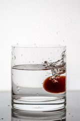  splashing water from a tomato in a whiskey glass5