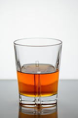 splashing whiskey in a glass on the background3