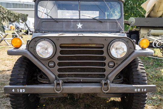Military car - antique all terrain vehicle grille and headlights - front photo - Powered by Adobe
