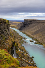 Beautiful landscape of Sigoldugljufur canyon with many small waterfalls and the blue river in Highlands of Iceland