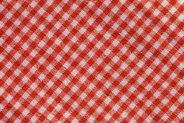 red fabric texture of checkered picnic blanket