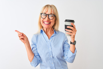 Middle age businesswoman wearing glasses drinking coffee over isolated white background very happy pointing with hand and finger to the side