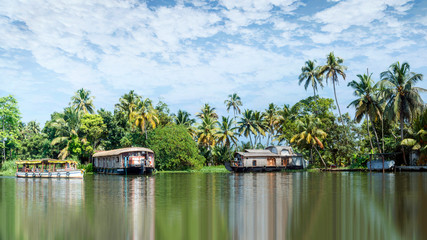 Fototapeta na wymiar BACKWATERS KERALA, INDIA Alappuzha or Allappey in Kerala is best known for houseboat cruises along the rustic Kerala backwaters, a network of tranquil canals and lagoons.