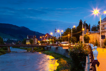 Evening at the river Dorna passing through Vatra Dornei city, Romania