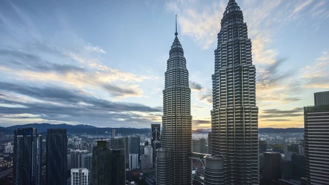 Aerial view of sunrise at Kuala Lumpur city centre, 4k time lapse Zoom in