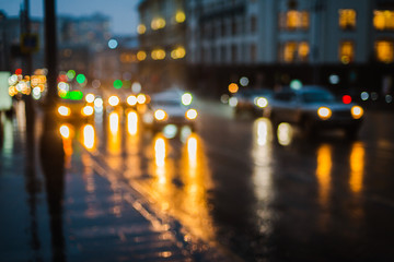 Wet night city street rain Bokeh reflection bright colorful lights puddles sidewalk Car