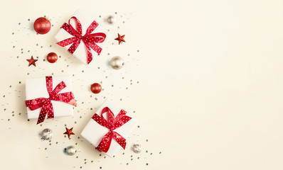 Christmas gift box with baubles - overhead view flat lay