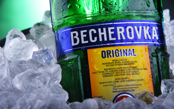 Bottle of Becherovka bitters in bucket with crushed ice