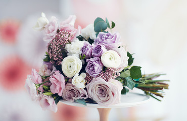 beautiful delicate flower bouquet with roses, ranunculuses, eustomas and carnations