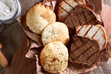 Bakery - gold rustic crusty loaves of bread and toast. Still life captured from above