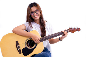 Fototapeta premium Woman playing a acoustic guitar isolated on white background.