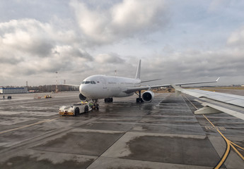 Fototapeta na wymiar Airplane at the terminal gate ready for takeoff