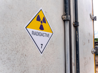 Radiation warning sign on the transport label Class 7 at the Door of the transport truck container