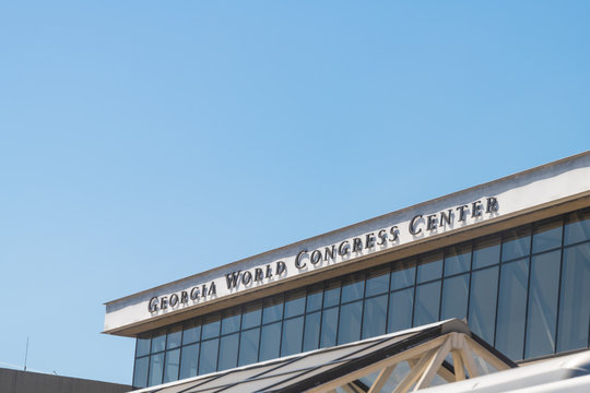 Atlanta, USA - April 20, 2018: Exterior of building with modern architecture and sign for Georgia World Congress Center