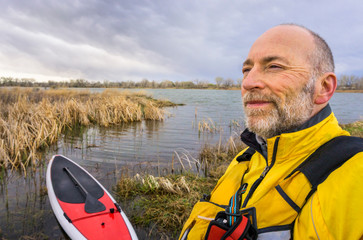 senior SUP paddler environmental  portrait