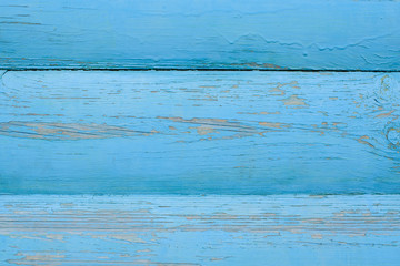 The wooden wall is blue. Background. Texture.