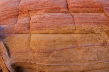texture of pink, yellow and orange stone wall at Valley of Fire State Park in Nevada