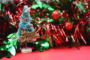 Chistmas pine tree with red and green tinsel