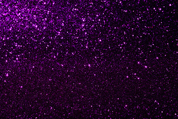 Abstract violet purple colored blured sparkling background with focused area.. Holiday festive concept. Glitter confetti.