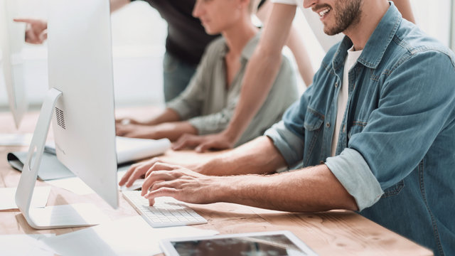 close up. a young man analyzing the information coming into the office