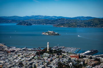 Very high view looking from downtown San Francisco towards Coit tower and Alcatraz Island