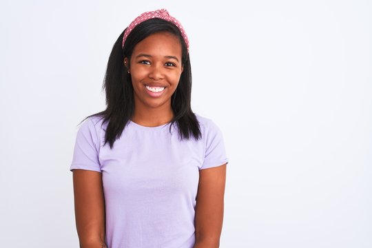 Beautiful young african american woman wearing a diadem over isolated background with a happy and cool smile on face. Lucky person.