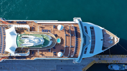 Aerial top view photo of huge cruise liner docked in Mediterranean port