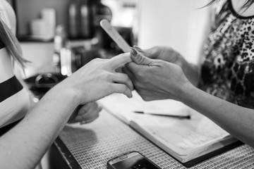 woman who is manicuring her hands