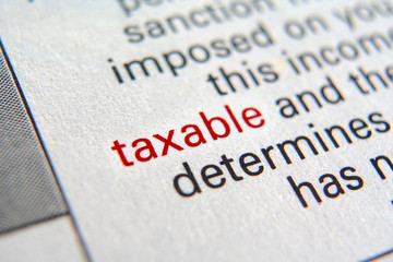 Tax form business financial concept with Close-Up TAXABLE on red