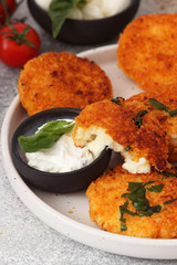 Fried potato pancakes with mozzarella and basil