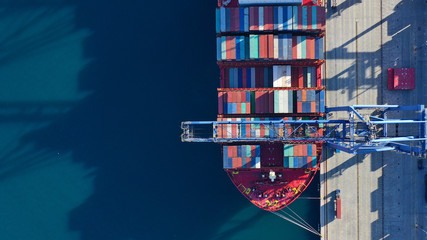 Aerial top down photo of industrial cargo container logistics terminal port with cranes loading unloading to container ships - obrazy, fototapety, plakaty