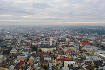 above the roofs on sunset. old european city. Ukraine Lviv