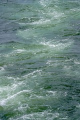 Aqua green blue waves on Lake Michigan on windy day, background, abstract