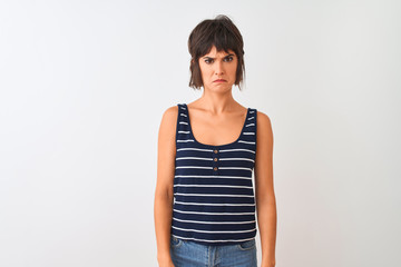Fototapeta na wymiar Young beautiful woman wearing striped t-shirt standing over isolated white background depressed and worry for distress, crying angry and afraid. Sad expression.