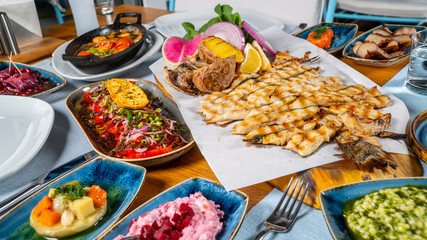 Turkish and Greek Traditional Dinning Table with Special Alcohol Drink Raki. Ouzo and Turkish Raki is a dry anise flavoured aperitif that is widely consumed in Turkey, Greece, Cyprus and Lebanon